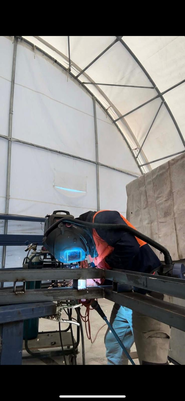 MIG welder working on structural steel fabrication, Gold Coast QLD